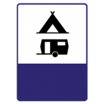 Pakistani informative road sign showing a tent and caravan symbol marking a camping and caravan site
