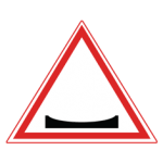 Pakistani cautionary road sign showing a concave dip in the road surface inside a red-bordered triangle