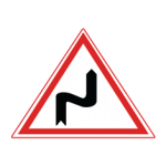 Pakistani cautionary road sign showing a double bend with the first curve to the right inside a red-bordered triangle