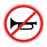 Pakistani no horn road sign showing a black horn symbol crossed by a red diagonal line inside a red circle