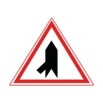 Pakistani cautionary road sign showing an oblique side road joining from the left inside a red-bordered triangle