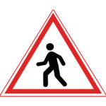 Pakistani cautionary road sign showing a walking pedestrian figure inside a red-bordered triangle