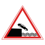 Pakistani cautionary road sign showing a car falling from a quay edge into water inside a red-bordered triangle