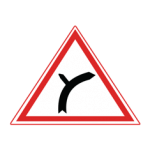 Pakistani cautionary road sign showing a road forking into two branches inside a red-bordered triangle