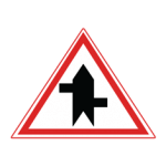 Pakistani cautionary road sign showing a staggered junction with the left arm first inside a red-bordered triangle