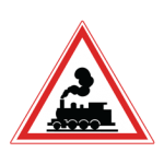 Pakistani cautionary road sign showing a black steam locomotive inside a red-bordered triangle, warning of an unguarded railway crossing